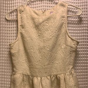Cream Peplum Sleeveless Top